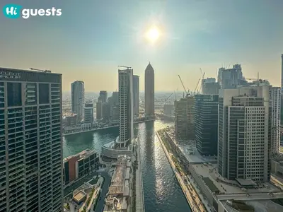 a view of a city with a river and buildings at HiGuests - High Rise Studio Haven in Business Bay in Dubai