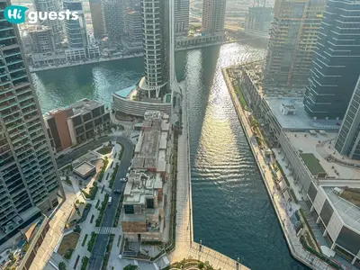 an aerial view of a river in a city with tall buildings at HiGuests - High Rise Studio Haven in Business Bay in Dubai