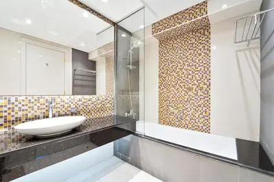 a bathroom with a sink and a mirror at Refined 1 bedroom - Upper Crest - Near Dubai Mall in Dubai