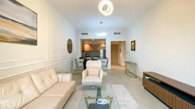 a living room with a couch and a table at 1BR Study luxury Furnished Utilities Included DXB in Dubai