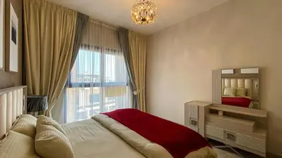 a bedroom with a bed and a large window at 1BR Study luxury Furnished Utilities Included DXB in Dubai
