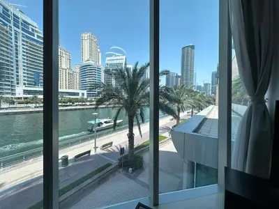 a view of a city from a room with windows at Modern 2 Bedroom Apartment in Dubai Marina in Dubai