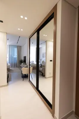 a living room with a sliding glass door at Luxury Studio - Private Jacuzzi & Burj Khalifa View in Dubai