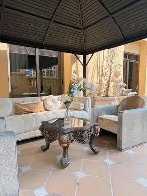 a living room with a couch and a coffee table at Smile Home Marina JBR Bed space in Dubai