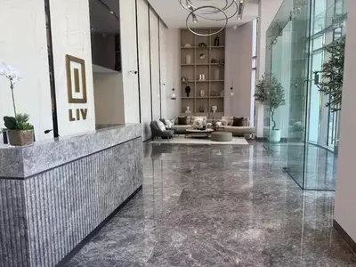 a lobby with a reception desk and a large room at SOLARTE Luxe - LIV Marina - Premium 2BR Residence in Dubai
