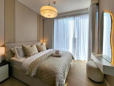 a bedroom with a bed and a large window at SOLARTE Luxe - LIV Marina - Premium 2BR Residence in Dubai