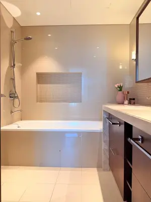 a bathroom with a shower and a bath tub at Dubai Mall connected, 38th floor, Amazing pool in Dubai