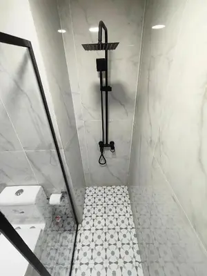 a bathroom with a shower with a toilet at Stylish JLT Apartment - Marina Skyline View - Next to Metro - Walk to Beach in Dubai