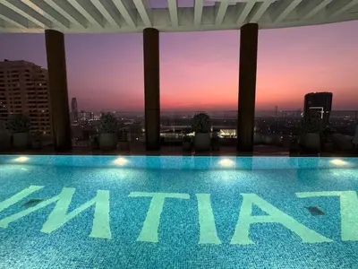a swimming pool on the roof of a building at Dubai corner at Westwood Imtiaz 1BR apartment in Dubai