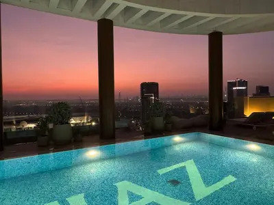 a swimming pool on the roof of a building at Dubai corner at Westwood Imtiaz 1BR apartment in Dubai