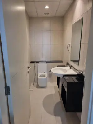 a bathroom with a toilet and a sink at شقة بالجي في سي Spacious apartment in Damac Ghalia JVC, Dubai in Dubai