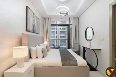 a bedroom with a bed and a large window at Vogue Business Bay Aykon City Close to Downtown Burj Khalifa and Dubai Mall Burj Khalifa and Dubai Mall, One Bedroom Apartment with Balcony and City View, Access to all Amenities in Dubai