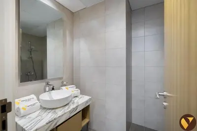 a bathroom with a sink and a mirror at Vogue Business Bay Aykon City Close to Downtown Burj Khalifa and Dubai Mall Burj Khalifa and Dubai Mall, One Bedroom Apartment with Balcony and City View, Access to all Amenities in Dubai