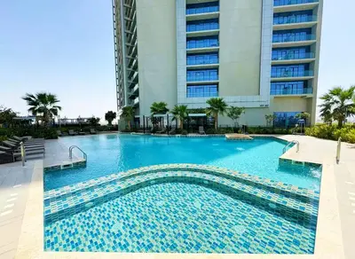 a large swimming pool in front of a building at Vogue Business Bay Aykon City Close to Downtown Burj Khalifa and Dubai Mall Burj Khalifa and Dubai Mall, One Bedroom Apartment with Balcony and City View, Access to all Amenities in Dubai