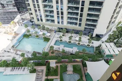 an overhead view of an apartment complex with two pools at Vogue Business Bay Aykon City Close to Downtown Burj Khalifa and Dubai Mall Burj Khalifa and Dubai Mall, One Bedroom Apartment with Balcony and City View, Access to all Amenities in Dubai