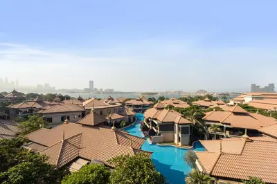 an aerial view of a resort village with blue water at Palm Retreat - Anantara North - Palm Jumeirah in Dubai