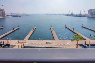 a view of a large body of water at Cozy 3BR Sea-View Apartment in La Rive 1 in Dubai