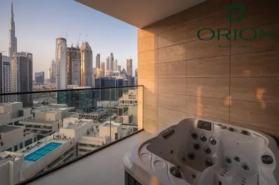 a bathroom with a view of a city skyline at Luxury 2BR with Private Jacuzzi Burj & Canal Views MINUTES FROM DUBAI MALL AND BURJ KHALIFA in Dubai