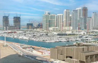 a view of a harbor with boats in a city at Elegant 1BR Apartment with Partial Sea View by EE holiday homes in Dubai