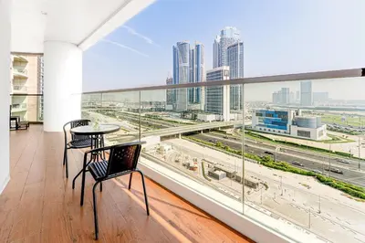 a balcony with a view of a city skyline at Luxury 1BR Terraces Private Jacuzzi Business Bay in Dubai