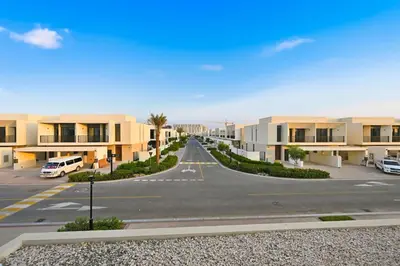 an empty road in the middle of a parking lot at Golden Stays - Chic 4BR Retreat I Luxe Touches & Serene Views in Dubai
