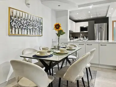 a dining room with a table and chairs at Breathtaking 2BR in Marina - Steps to Metro in Dubai