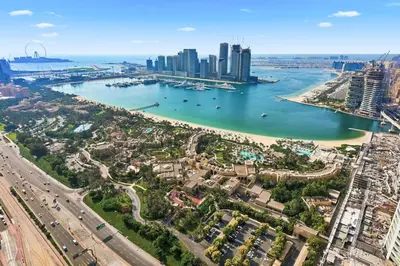 an aerial view of a city and a harbor at Golden Stays - Palm Views I Luxe 4BR Getaway I Tranquil Charm in Dubai