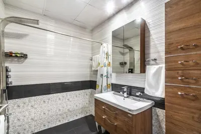a bathroom with a sink and a mirror at GuestReady - Studio l Close to Metro Station in Dubai