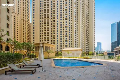 a swimming pool in a city with tall buildings at bnbmehomes - Murjan 5 in Dubai