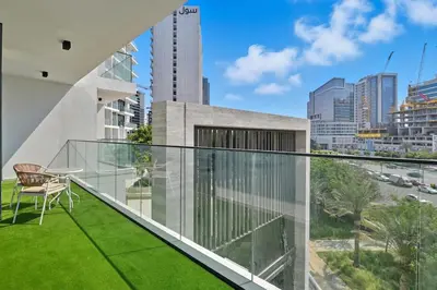 a balcony with a view of the city at Golden Stays - Luxury 1BR Apartment I Cinema Access I Pool & Gym in Dubai