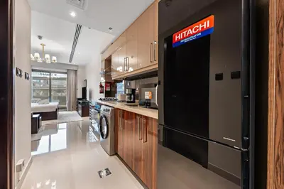 a kitchen with a sign on the side of a appliance at Full burj Khalifa view chic Studio in Dubai