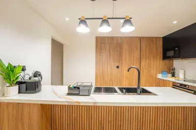 a kitchen with a sink and a counter top at EasyGo - Luxury 3BR with Maid's Room, Dubai Eye View, JBR in Dubai