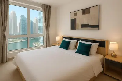 a bedroom with a large bed with a large window at Marina View Apartment Near JBR Beach & Marina Mall in Dubai