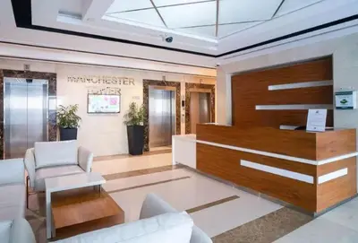 a lobby with a reception desk in a building at Marina View Apartment Near JBR Beach & Marina Mall in Dubai