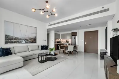 a living room with a couch and a table at 1BR at Beach Isle Tower Emaar Beach front by EE Holiday Homes in Dubai