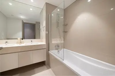a bathroom with a tub and a sink and a shower at Mahogany 23 - 2BR 10PAX - Burj Khalifa View Central in Dubai