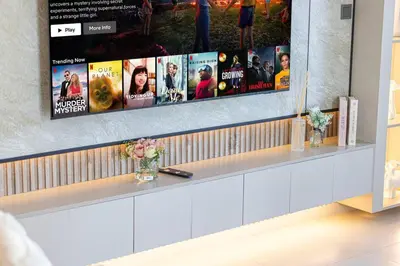 a row of movie posters on a wall at Mahogany 23 - 2BR 10PAX - Burj Khalifa View Central in Dubai