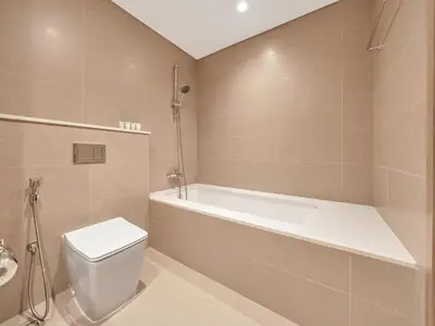 a bathroom with a tub and a toilet and a sink at New-Best Burj Khalifa View I 2BR I Walk DubaiMall in Dubai
