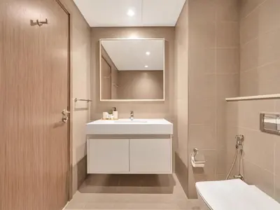 a bathroom with a white sink and a mirror at New-Best Burj Khalifa View I 2BR I Walk DubaiMall in Dubai