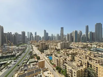 an aerial view of a city with tall buildings at Full Burj Khalifa & Fountain Views - Luxury 2BR in Downtown Dubai in Dubai
