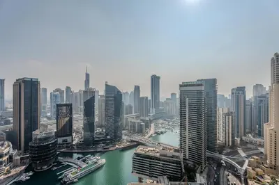 an aerial view of a city with a river and buildings at Gala Guests - Luxury Dubai Marina View Apartments - 1 min Walk to Tram in Dubai