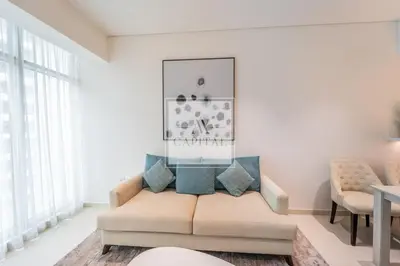 a living room with a couch and a table at Beach Access, Skyline Views, 2 Bedroom and Hall in Dubai