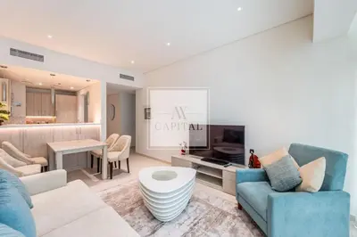 a living room with a couch and a table at Beach Access, Skyline Views, 2 Bedroom and Hall in Dubai
