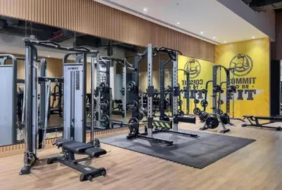 a gym with several tread machines in a room at Beach Access, Skyline Views, 2 Bedroom and Hall in Dubai