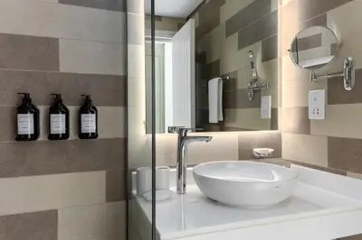a bathroom with a sink and a mirror at Beach Access, Skyline Views, 2 Bedroom and Hall in Dubai