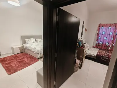 a room with a bed and a room with a closet at 2 Bedroom Furnished Apartment in Dubai