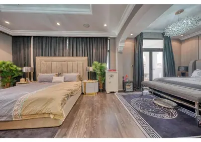 a bedroom with a large bed and a large at Signature Palm Villa Ultra-Luxury 5 BDR Retreat in Dubai