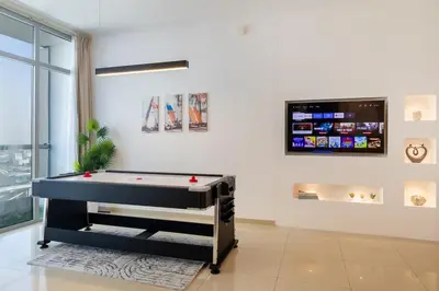 a room with a pool table and a flat screen tv at Luxury 3 BR in Dubai Marina By dPie DEC 2003 in Dubai
