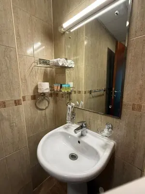 a bathroom with a sink and a mirror at Zenstay-Modern 2BR in JLT-Near Marina& Metro in Dubai