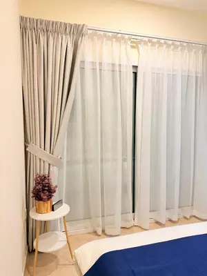 a window with white curtains in a room at Zenstay-Modern 2BR in JLT-Near Marina& Metro in Dubai
